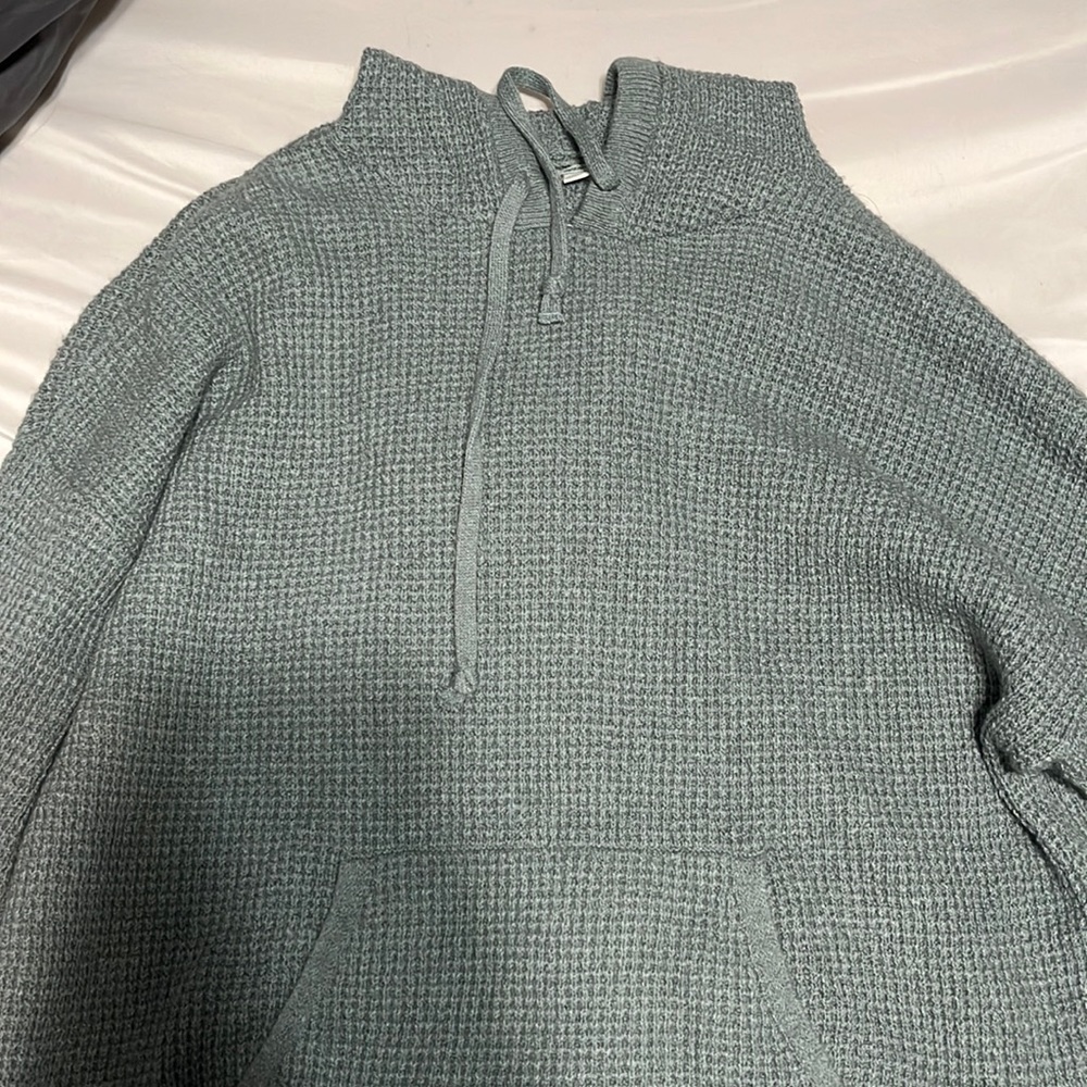 green knit sweatshirt